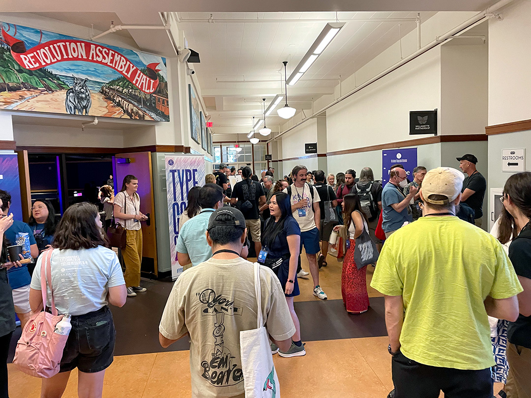 Attendees mingle during a program break at TypeCon 2023. Photo by John D. Berry