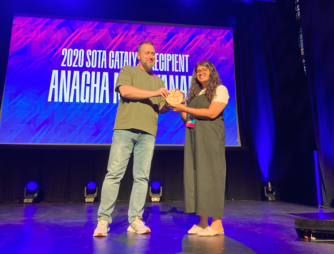 The 2020 SoTA Catalyst Award being presented to Anagha Narayanan by SoTA Secretary Neil Summerour at TypeCon. Photo by Delve Withrington